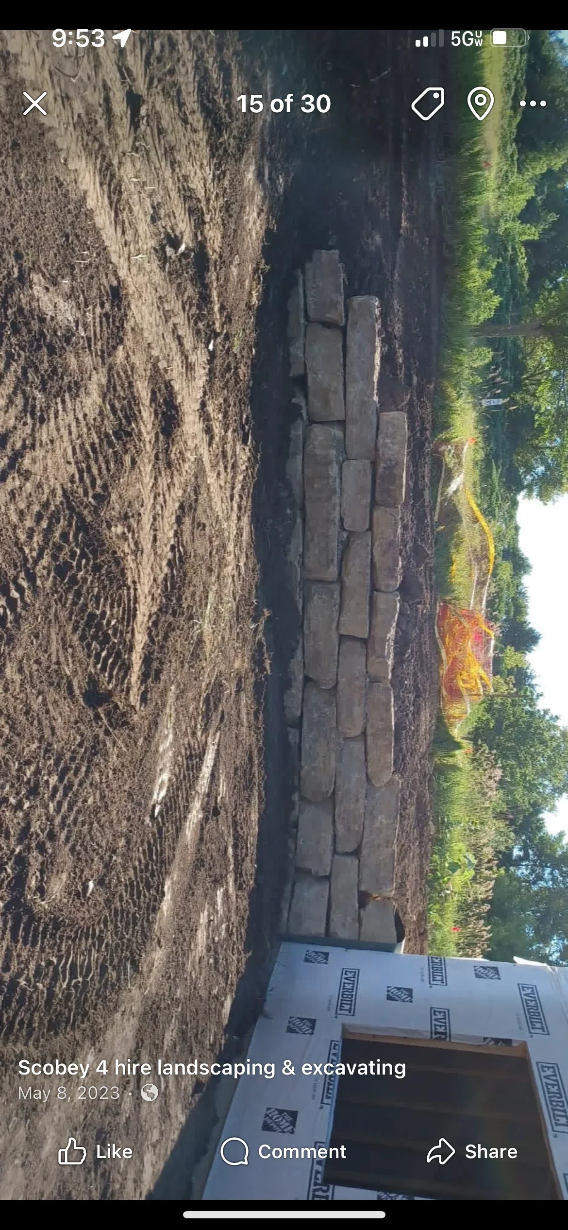 Excavated driveway site with compacted base material and grading work in progress